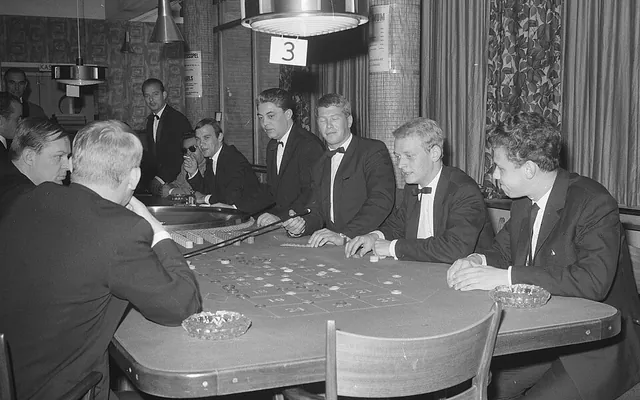 Visitors playing roulette at a casino table