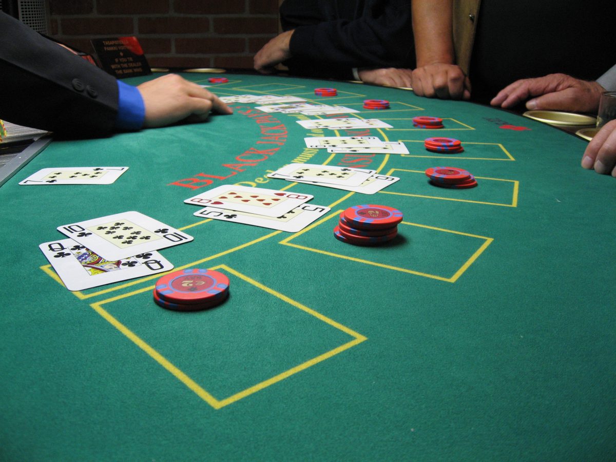 Players and chips at a blackjack table